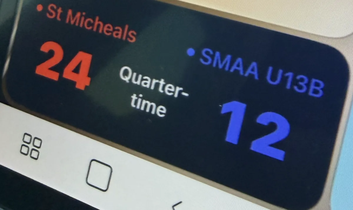 Live score tile on a CarPlay dashboard showing the score and Quarter-time